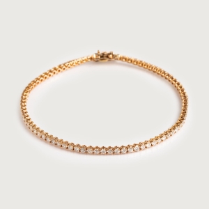 gold tennis bracelet with diamonds
